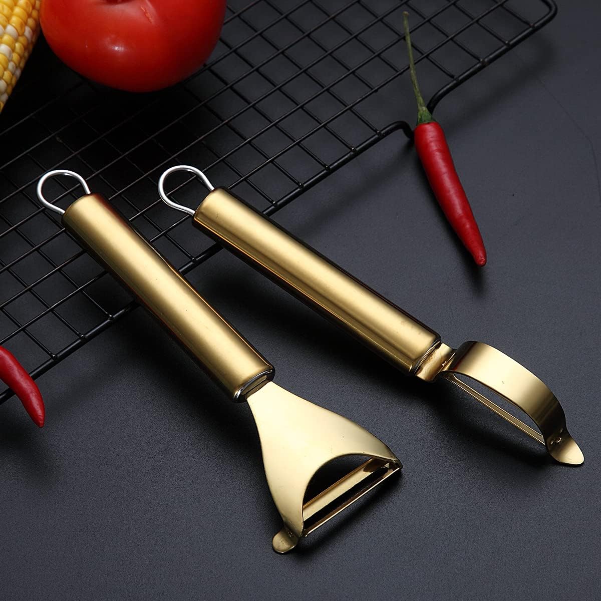 The Gold-Finish Peeler Duo beside fresh vegetables